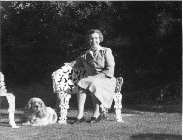 On one of her white cast-iron Victorian garden chairs, Hazle seated perhaps remembering Nancy's and Willard's spectacular wedding there five years earlier. Martinez, circa 1945
