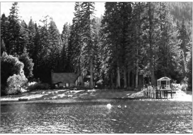 The Homewood house, seen from the lake in 2003, looks almost exactly as it did in the 1920s, except that then it was entirely screened from the water by alders and willows.  
