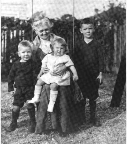 Grandmother Shurtleff (Charlotte Avery) at Euclid Avenue with her Shurtleff grandchildren in 1921. She also had four grandchildren from her first marriage to John David Meek. (L-R) Gene, Nancy, and Lawton.