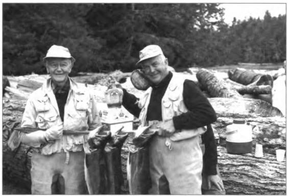 Roy and Gene on the Tlel River, British Columbia, in the mid-1970s. A prankster displays a bottle of Roy's favorite beverage. Roy's later years were full of adventure and fun, fishing up and down the west coast with family and friends.