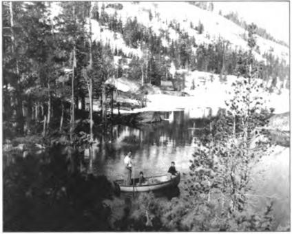 Paddling the EZ in the sparkling channel beside the cabin in the snow, circa 1955.