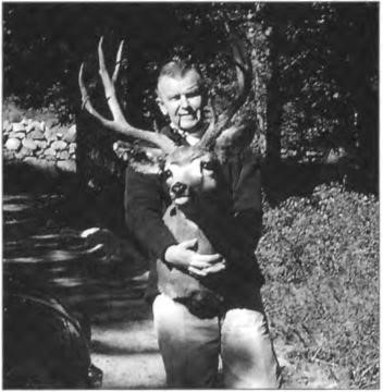 Gene with the trophy-deer-head removed from the burning Echo cottage. Meeks bay Tahoe, circa 1960.