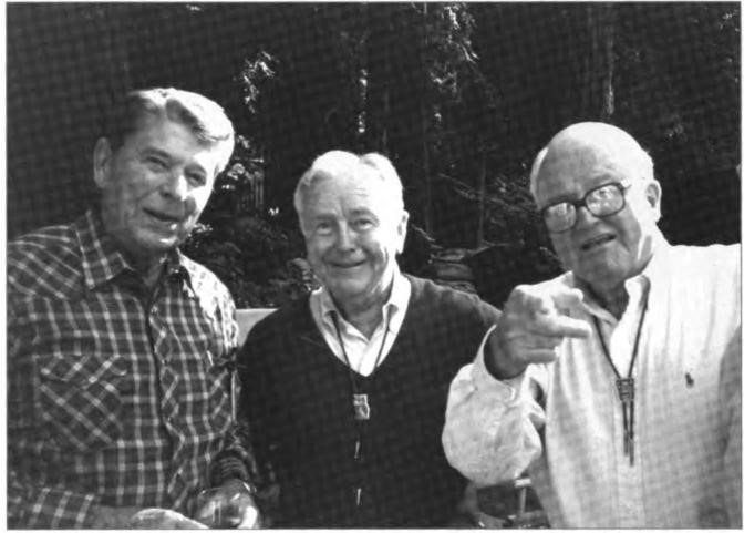 Gene (center) with U.S. President Ronald Reagan (left), a fellow Bohemian, and brother-in-law, Willard Miller at the Bohemian Grove, July 1989.