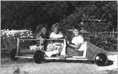 Jeff, Linda and Bill in a roller coaster Bill had built, summer 1952.