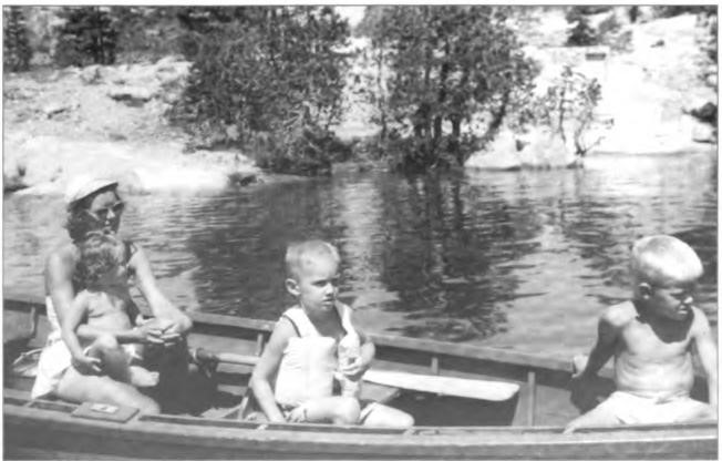 Nancy Miller, little Nancy, Jack 
Hansen and Steve in the Putt 
Putt at Echo Lake, circa 1950