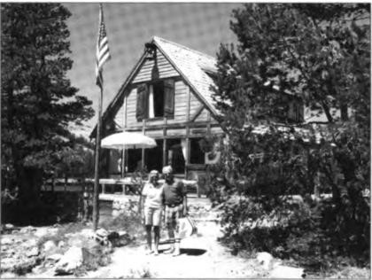 Nancy and Gene in front of the entirely renovated Interlachen cabin following the terrible fire in 1960 (see p. 241)