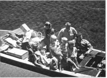 Shurtleffs and Millers, arriving by water taxi, fully stocked for their first visit to their new cabin at Echo Lake, 1949.