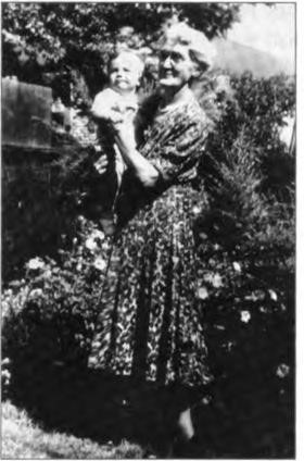 Cordelia Peet hold-ing her first great-grandchild, James Lawton Kelly, circa 1950.