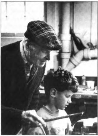 David Lawton Gutterman, Dorothy's great- 
grandson getting woodworking instructions from 
his great-granduncle, Don Lawton, circa 1989.
