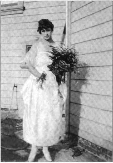 Dorothy with a bridal bouquet, perhaps in preparation for Hazle's wedding, circa 1913.