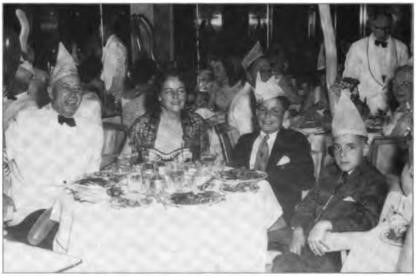 Ed and Jerry with their two sons, Randy and Bob, celebrating at sea on the steamship Conine, 1956.