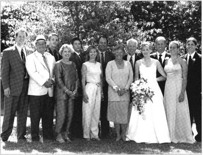 Wedding of Michael Lawton Martin and Justine Louise Ford at Willis ranch in Healdsburg, May 2002. 
Michael is the eldest son of Edward and Willi Martin. 
Everyone in the photo (except the "friend") has the surname Martin. 
Front row (left to right): Blair, Charlie, Debbie, Pam, Willi, Justine, and Julie. 
Back row: Brandon, Patrick, Jeff, a friend, Michael, and Matthew.
